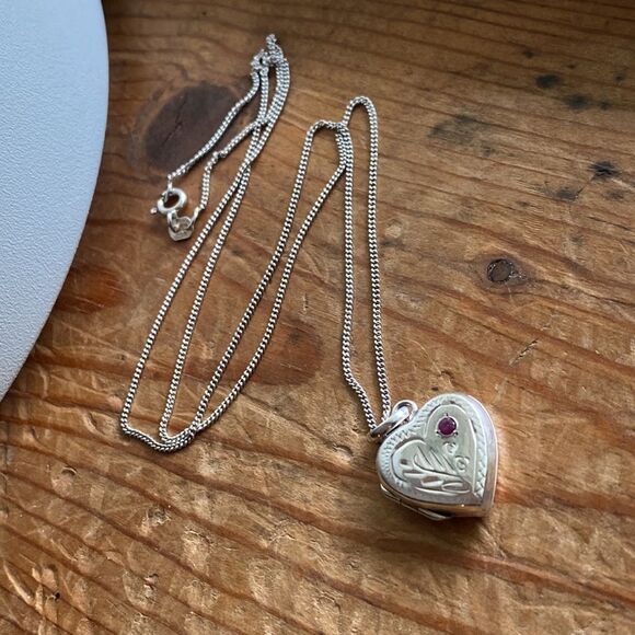 Jewelry - 💛 Sterling Silver Ruby Etched Flower Heart Locket